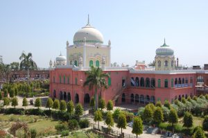 The Darul Uloom in Deoband, India where they teach the Dars-i-Nizami Shuaib, Muhammad. "Darul Uloom Deoband." Wikimedia Commons, Public domain, https://commons.wikimedia.org/wiki/File:Darul_Uloom_Deoband.jpg. Accessed 12 Mar. 2025.